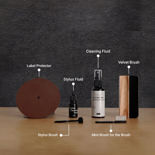 Cleaning a vinyl record with the 6-in-1 kit brush and fluid