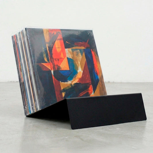 Black Vinyl Break steel record player stand displaying LP collection on tabletop