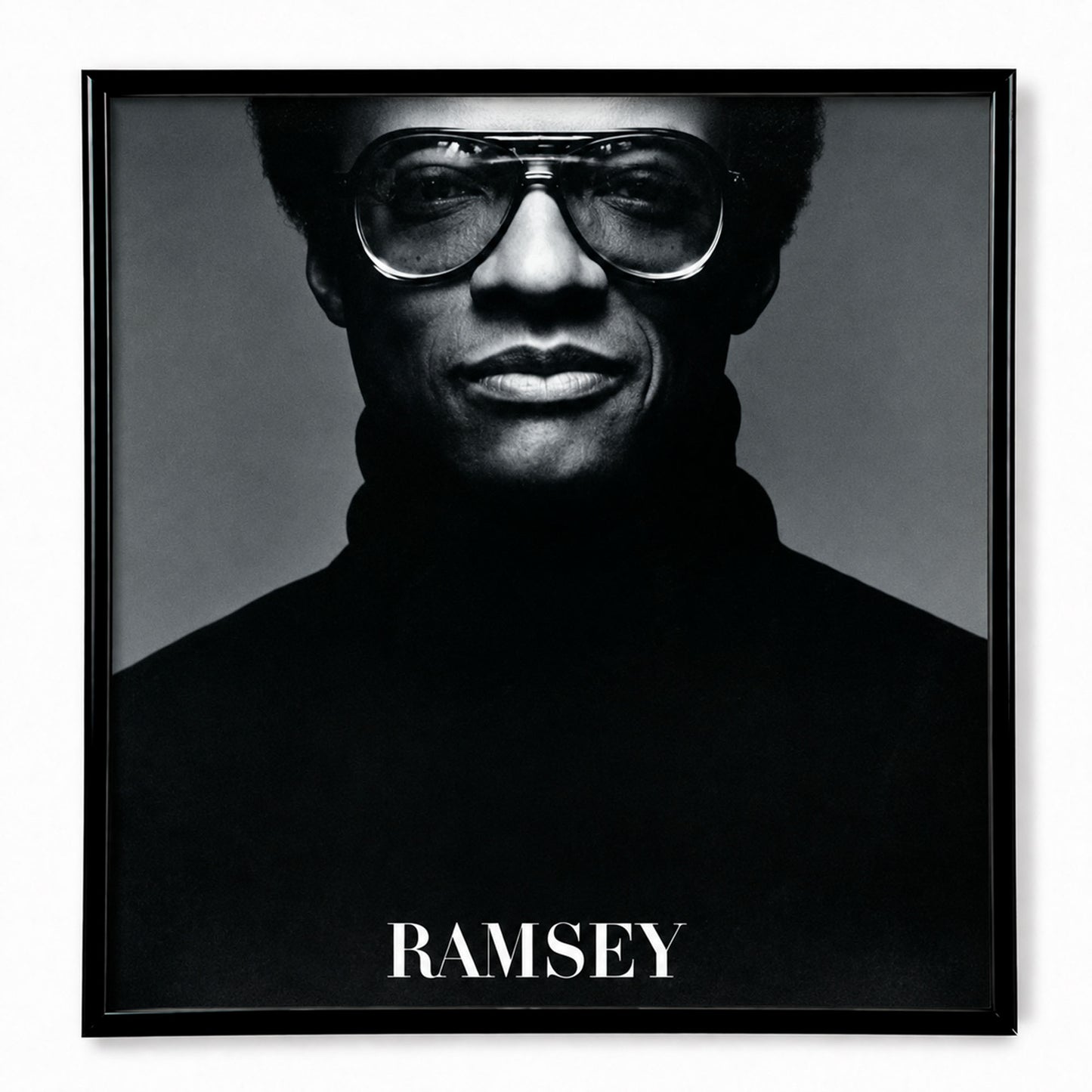 12-inch vinyl record frame displaying Ramsey Lewis album cover on a wall — Keep Them Spinning