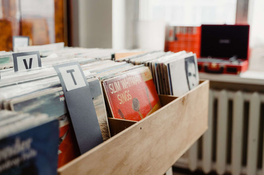 Vinyl records in a record store showcasing different formats and pressings