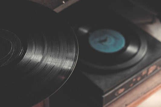 Turntable setup with vinyl record — overhead view showing platter, tonearm, and cartridge