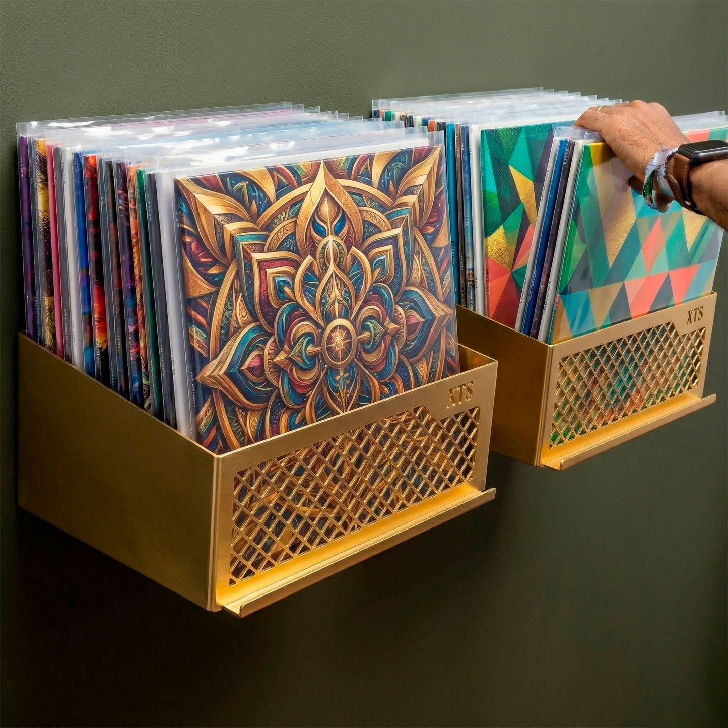Flying V x2 double wall-mounted vinyl record shelf in orange finish displaying LP album covers on a grey wall