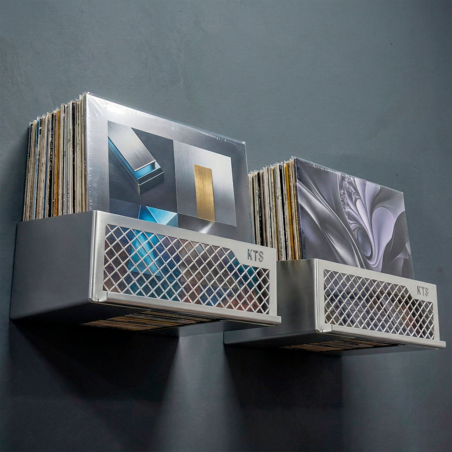 Flying V x2 double wall-mounted vinyl record shelf in green finish with vinyl records on teal wall