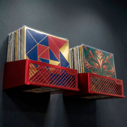 Flying V x2 wall-mounted record display in gold finish holding LPs with warm ambient lighting