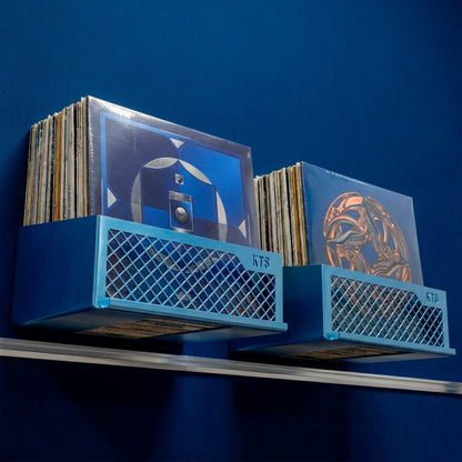 Flying V x2 double wall-mounted vinyl shelf in blue powder-coated steel displaying album covers