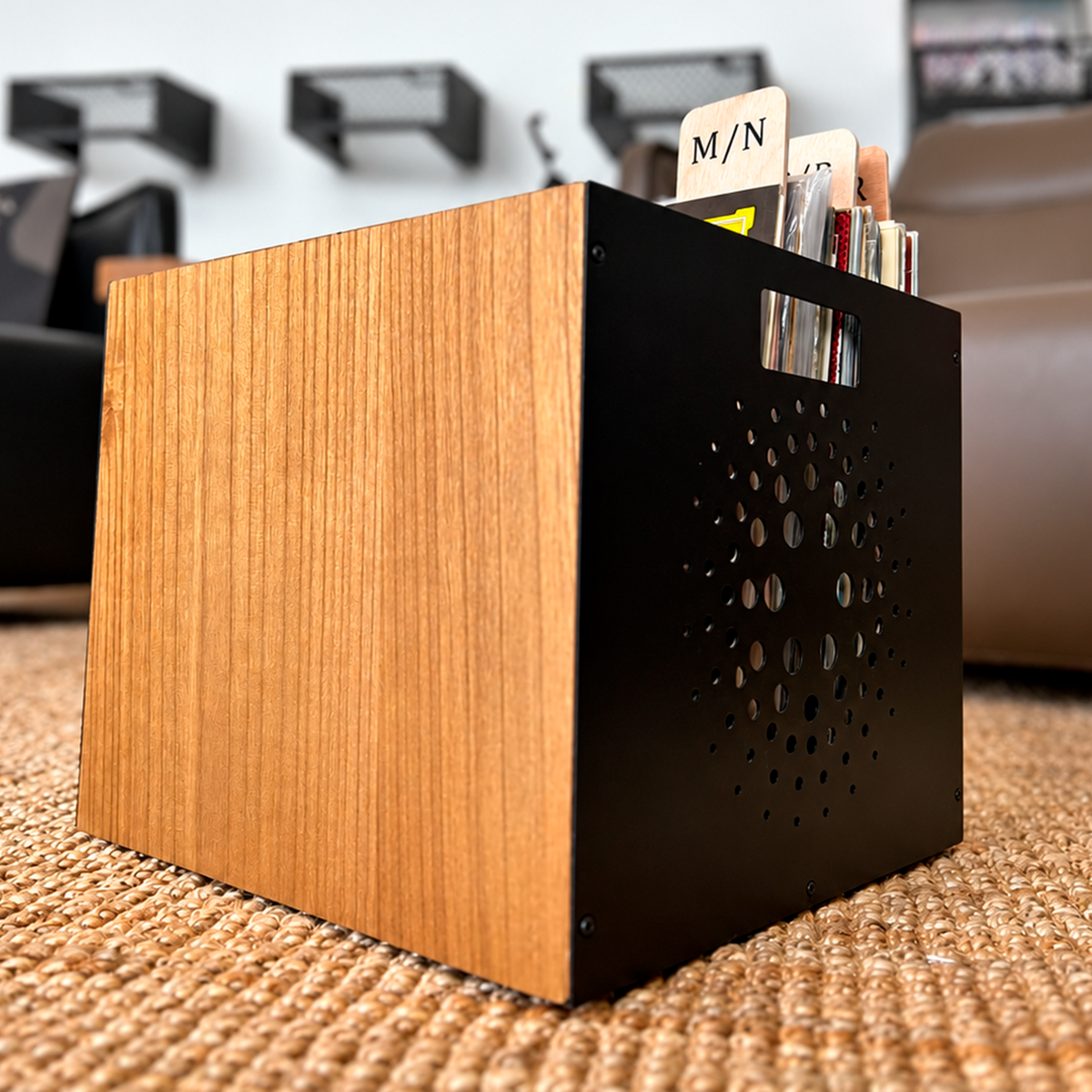 M/N record divider standing above vinyl records in a record crate