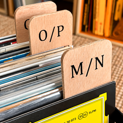 Close-up of the M/N and O/P plywood record dividers between vinyl records