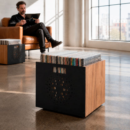 Close-up of the orbital perforated steel front on a solid wood Orbit vinyl crate