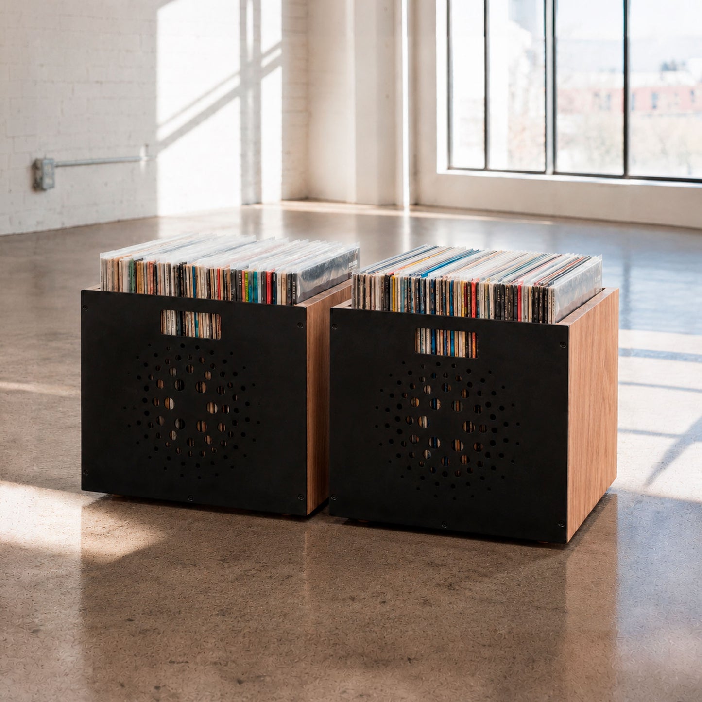 Two mid-century Orbit Box vinyl crates with perforated orbital steel fronts in Natural finish