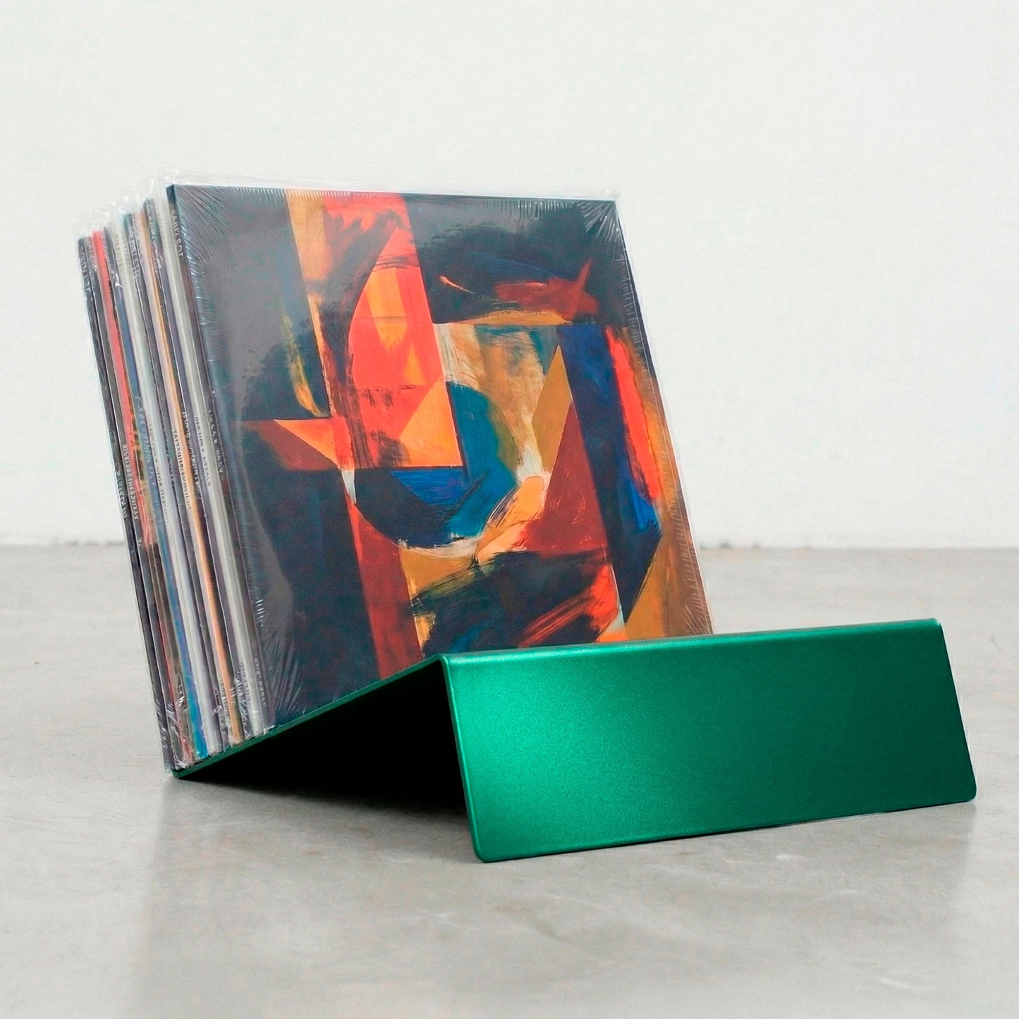 Green Vinyl Break steel vinyl record holder with LP collection and Now Playing display slot