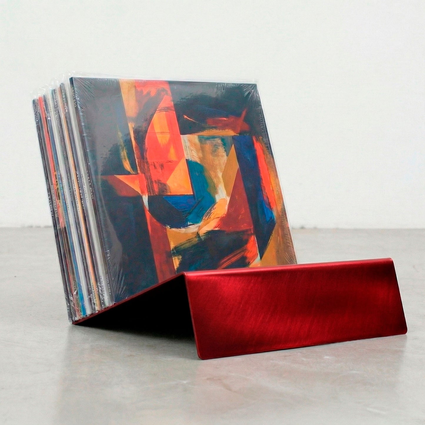 Red powder-coated Vinyl Break steel record stand for tabletop vinyl LP storage and display