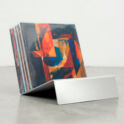 Silver Vinyl Break minimalist record display stand in brushed steel finish with vinyl records