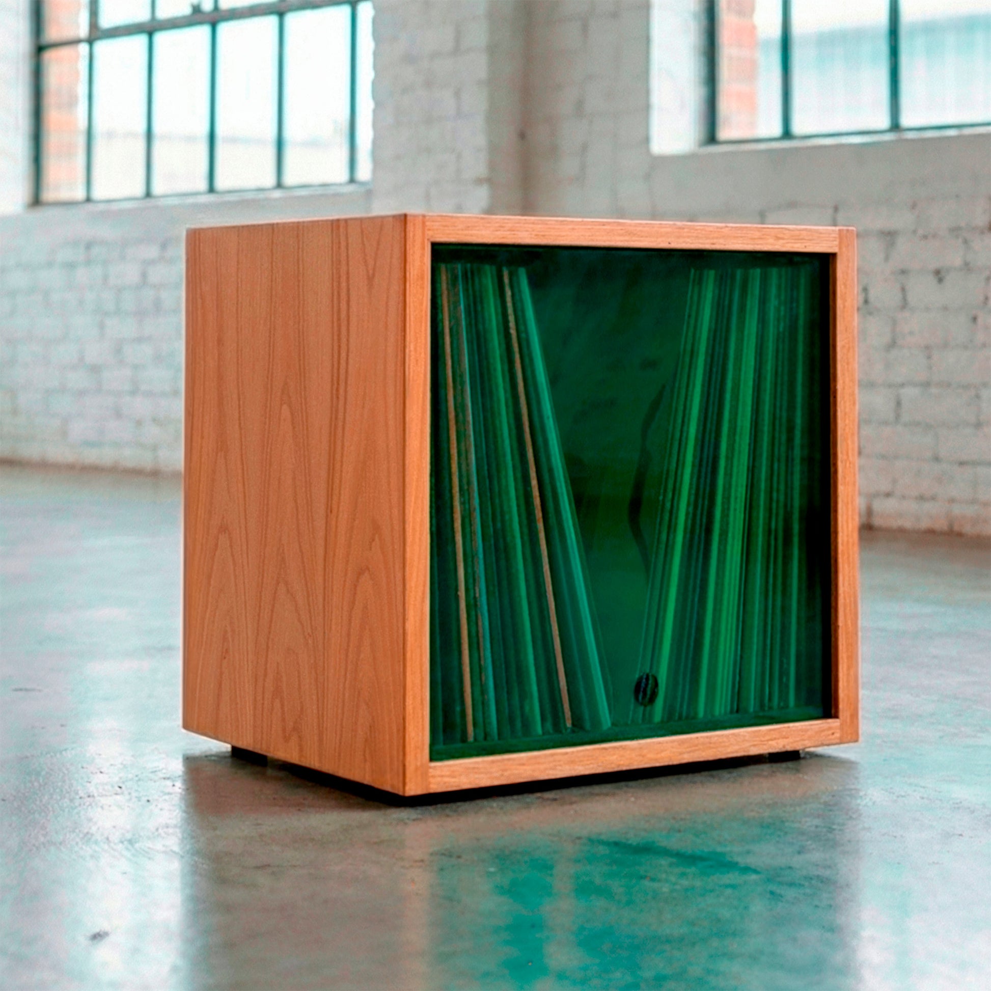 Wooden vinyl record storage cube with orange tinted acrylic front panel and LP records.