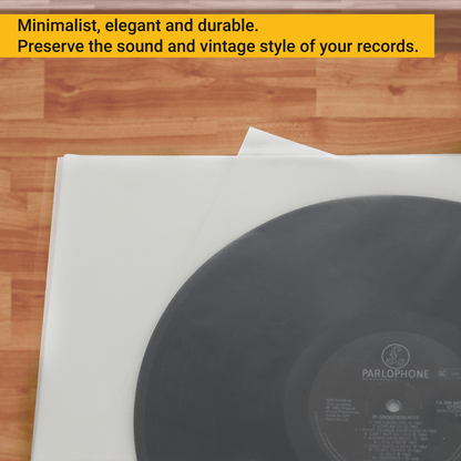 Translucent anti-static inner sleeves under a vinyl record on a wooden table