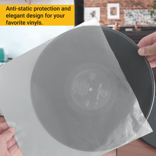 Stack of 50 anti-static sleeves next to a vinyl collection ready for upgrade