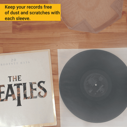 Vinyl record lying on a translucent anti-static inner sleeve next to its album cover