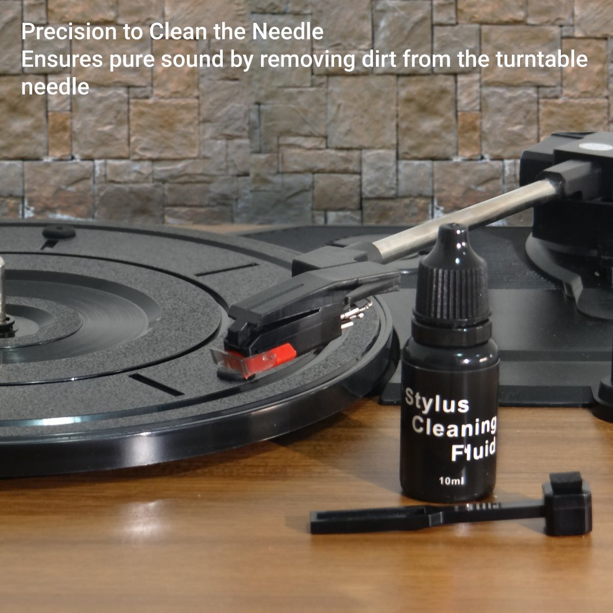 Turntable cleaning fluid and specialized brush next to the needle, showing how to keep it in optimal condition.